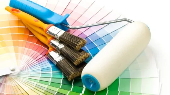 Brushes and paint-roller on a colour guide